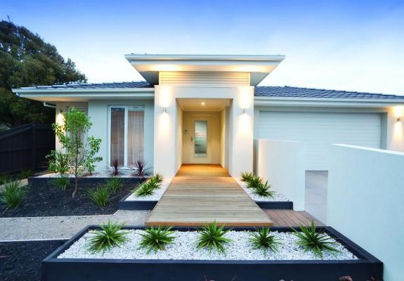 Facade and entry to a contemporary white rendered home in Australia.