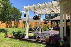 Backyard oasis with a shadow box fence and pergola