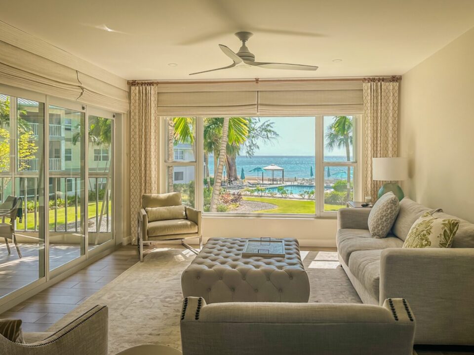 A living room in a home overlooking the ocean.