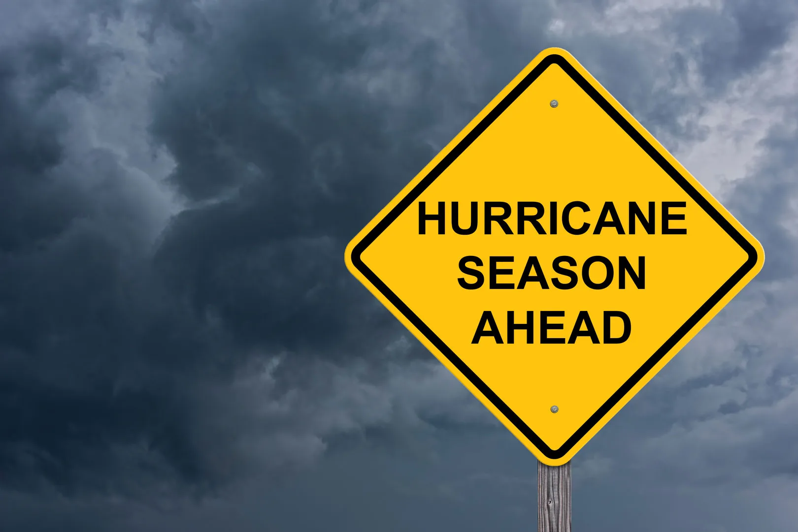 Road sign that reads “Hurricane Season Ahead”